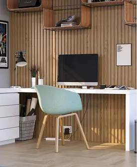 Modern home office with a wooden desk, upholstered chair, desktop computer, and slatted wood accent wall.