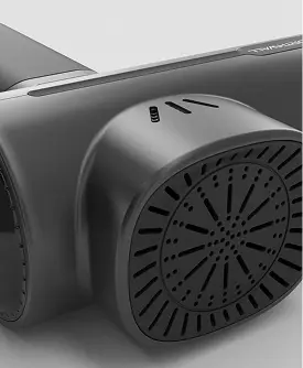 Close-up 3D product rendering of an electronic device featuring a rear cooling vent and matte black housing