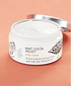 Single cosmetic jar with a bronze lid and white label against a plain white background.