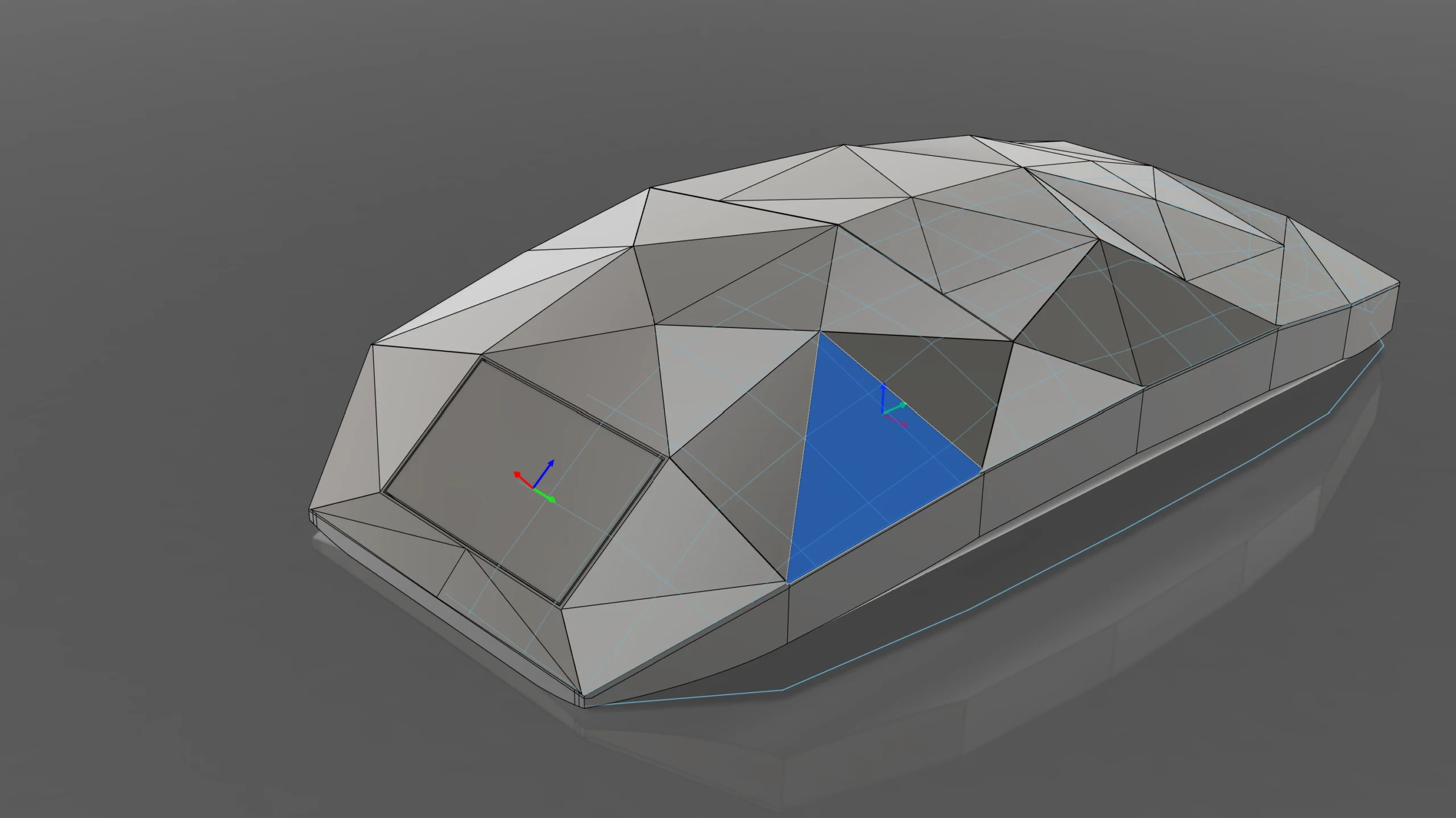 A 3D viewport displaying a low-poly, faceted gray model of a sleek, aerodynamic object, possibly a vehicle or ergonomic device, with one triangular face highlighted in blue and transform axes visible.