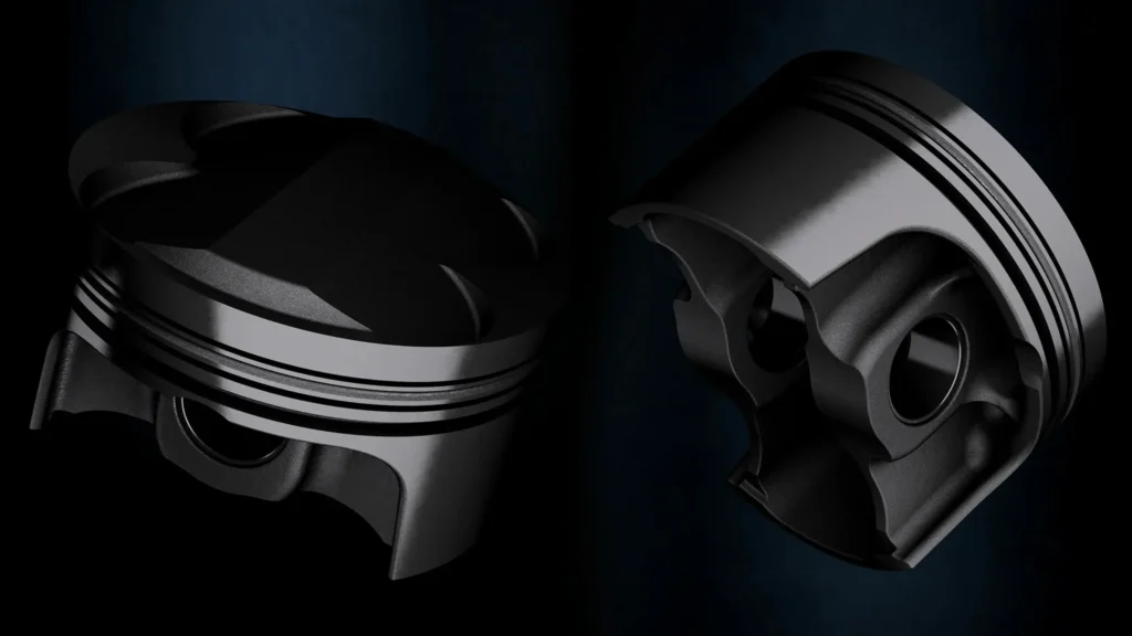 Two black automotive engine pistons displayed from different angles on a dark background.