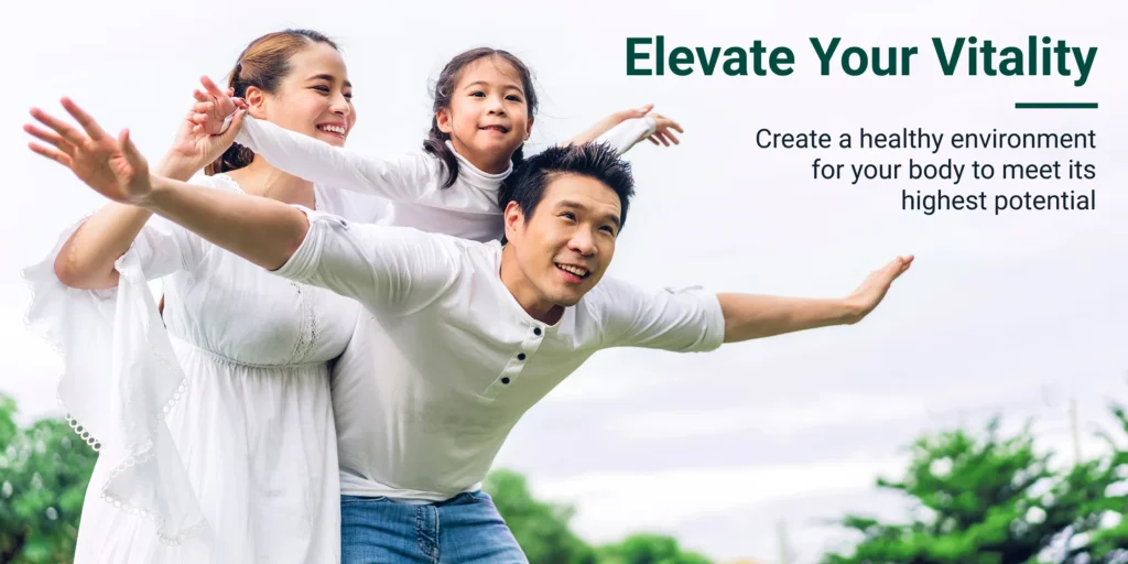 Happy family playing outdoors in white clothing with "Elevate Your Vitality" text for Etta Vita Amazon storefront banner design.